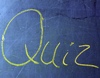 Rätsel und Quiz Foto einer Tafel auf der Quiz steht